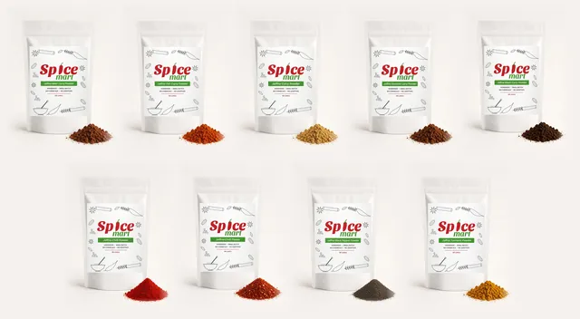 The nine Spice Mart 500g pouches in a row: meat, fish, curry, roasted curry, black curry, chilli powder, chilli flakes, black pepper and turmeric, each with a pile of its powder (generated pack renders)
